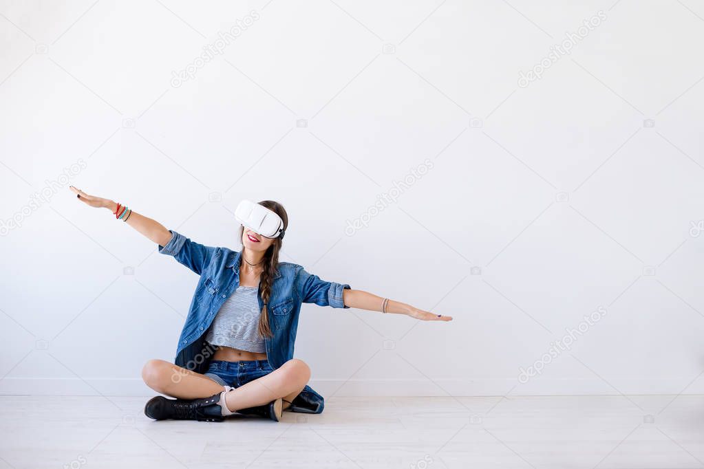 Girl traveling in virtual reality with VR glasses