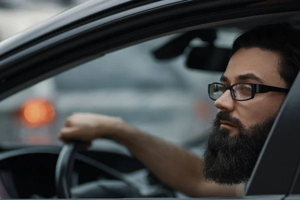 Close up portrait, serious man driving a car — Stock Photo, Image