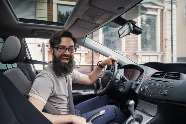 Happy charismatic man driving a car — Stock Photo, Image