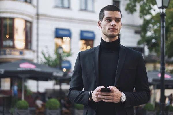 Businessman Texting Serious Young Businessman Holding Mobile Phone Looking Outdoors — Stock Photo, Image