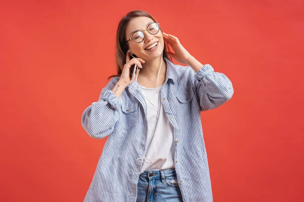 Portrait Attractive Casual Young Woman Smiling Earphones Glasses Isolated Red — Stock Photo, Image