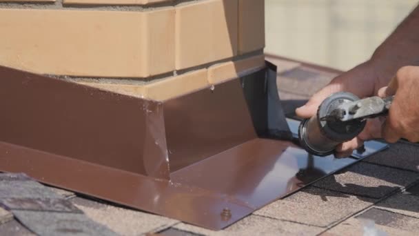 Roofing work. Sealing of air pipe joints. — Stock Video