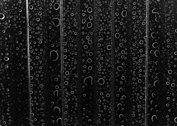 Zwarte Druppels Een Transparant Oppervlak — Stockfoto