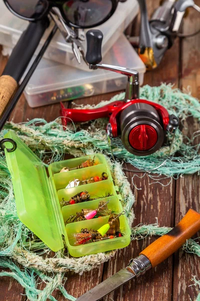 Different Fishing Tacles Rod Reels Wooden Brown Background Mockap Advertisment — Stock Photo, Image