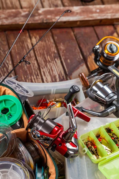 Different Fishing Tacles Rod Reels Wooden Brown Background Mockap Advertisment — Stock Photo, Image