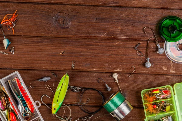 Diferentes Tacos Pesca Con Señuelos Carretes Sobre Fondo Marrón Madera —  Fotos de Stock