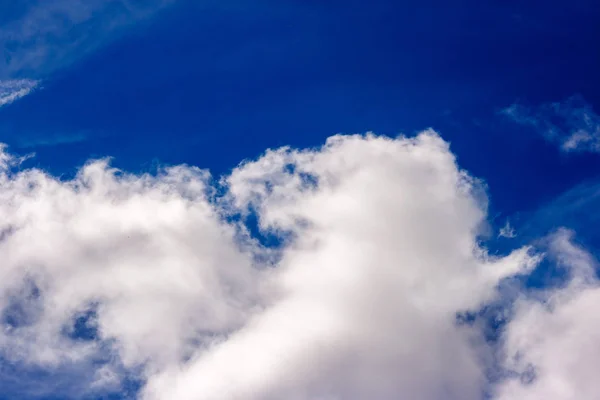 stock image dense and great white clouds on a beautiful sunny summer blue sky