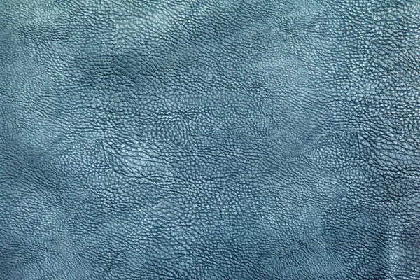 bright blue leather upholstery for furniture as background indoor closeup