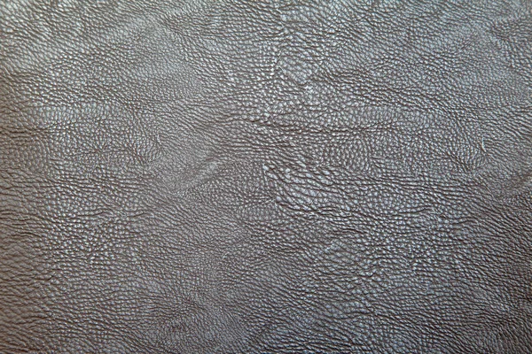 brown leather upholstery for furniture as background indoor closeup