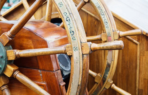 wooden ship retro steering wheel outdoor closeup