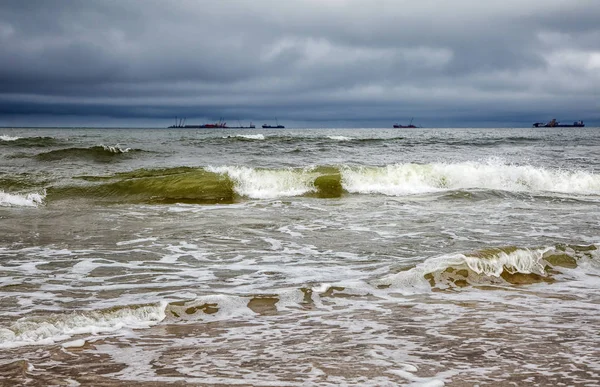 stock image stormy baltic sea with ships on gloomy autumn day