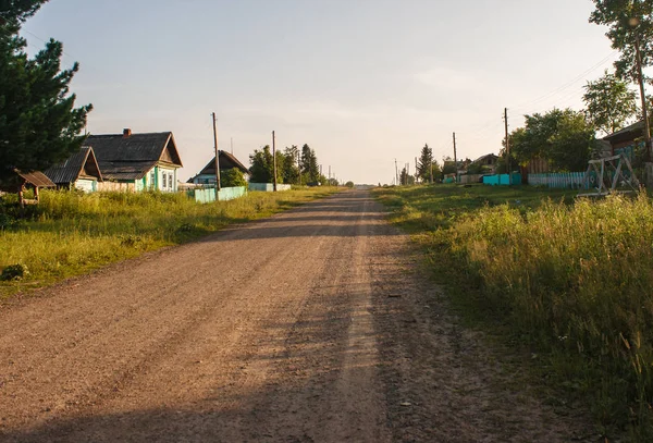 Dirt road in a russian village — Stock Photo, Image