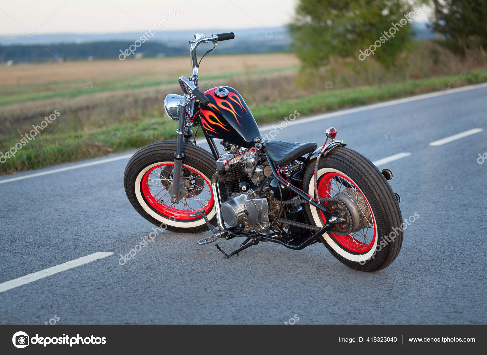 Custom bobber motorbike standing on a road. — Stock Photo