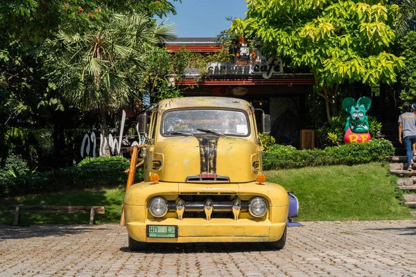 stock image SARABURI, THAILAND - NOVEMBER 04 2018: The 1951 Yellow colored Ford COE pickup truck with custom wheels parking at the car park , Thialand on November 04 2018.