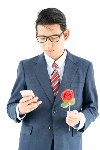 Close Photo Businessman Suit Holding Smartphone Red Rose White Background — Stock Photo, Image