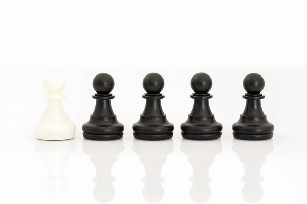 Black and white chess pieces on white background