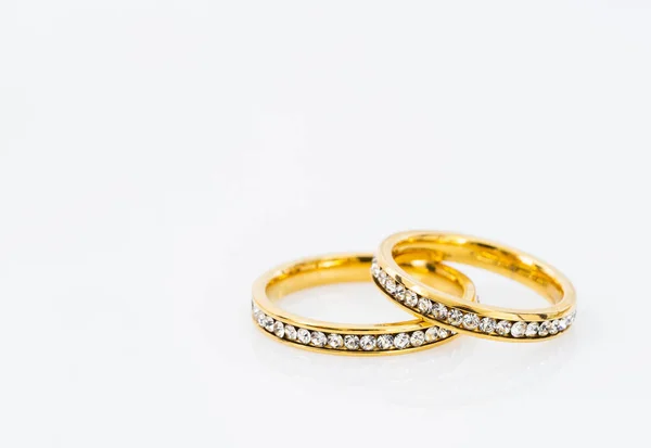 Gold wedding rings on white background — Stock Photo, Image