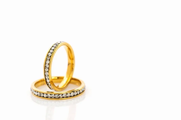 Gold wedding rings on white background Royalty Free Stock Photos