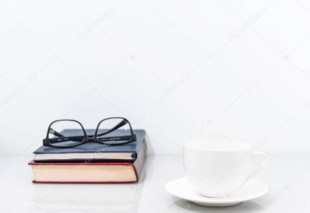 Coffee cup and old books 