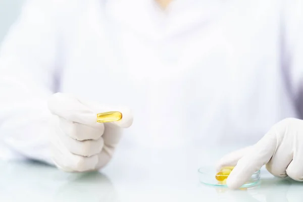 Close Scientist Hands Putting Nitrile Latex Gloves Holding Omega Capsule — Stock Photo, Image