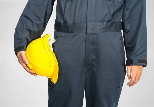 Cloes Worker Standing Blue Coverall Holding Yellow Hardhat Isolated Gray — Stock Photo, Image