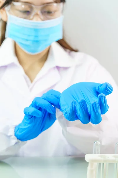 Close Scientist Hands Putting Nitrile Blue Latex Gloves Labcoat Wearing — Stock Photo, Image