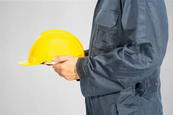 Cloes Worker Standing Blue Coverall Holding Yellow Hardhat Isolated Gray — Stock Photo, Image