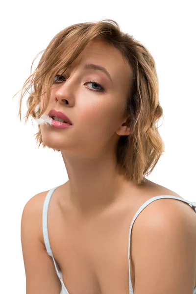 Woman with haircut and feather in her mouth shot — Stock Photo, Image