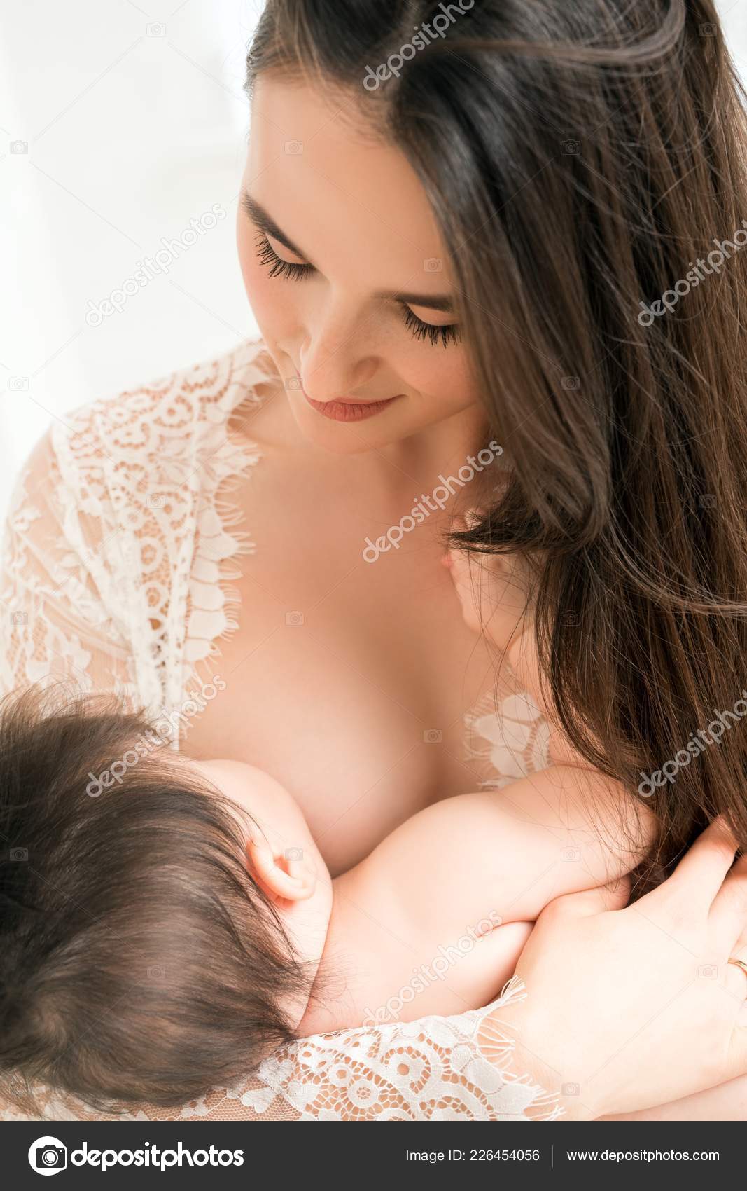 Nudist female breastfeeding