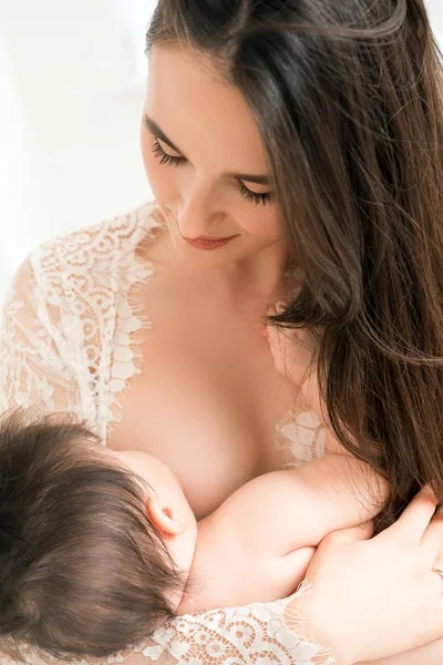 Woman breast-feeding her little son close up view — Stock Photo, Image