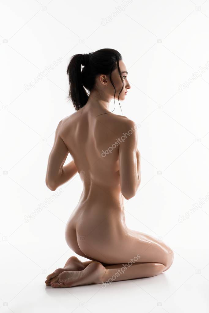Gorgeous nude brunette isolated rearview