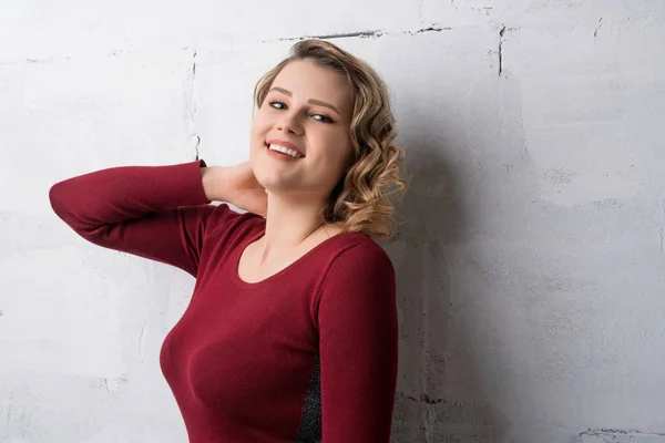 Happy young blonde in red dress cropped shot — Stock Photo, Image