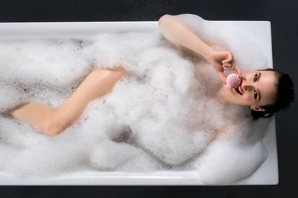 Happy brunette having bath high angle shot — Stock Photo, Image