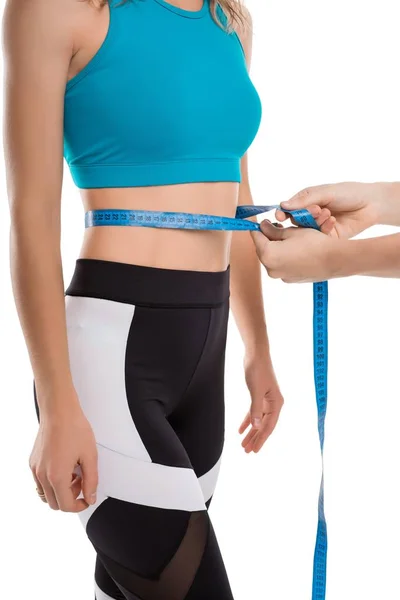 Trainer measuring figure parameters cropped shot — Stock Photo, Image