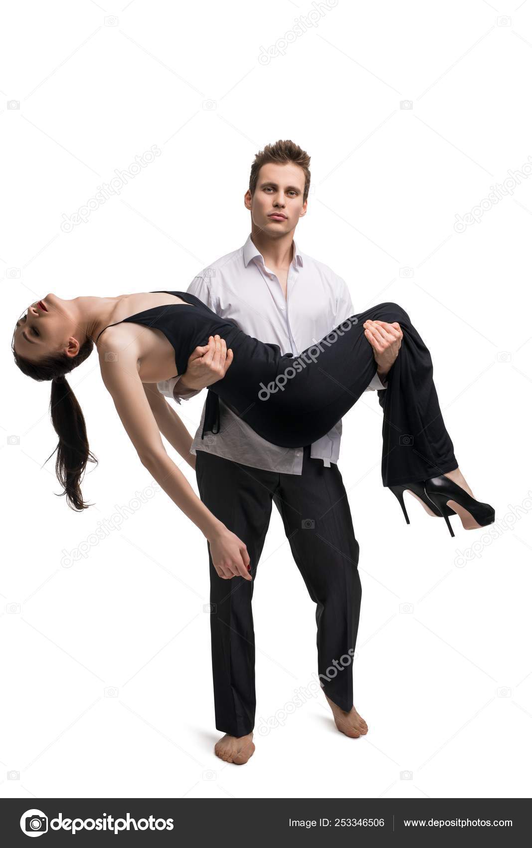 Man carying unconscious girl in his arms Stock Photo by ©Wisky 253346506