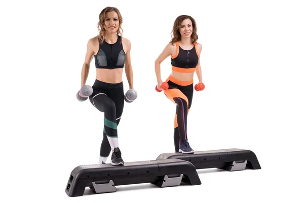 Two slim models in sportswear doing fitness view — Stock Photo, Image
