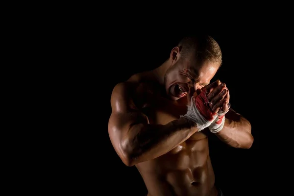 Shirtless muscular athlet put in place broken nose — Stock Photo, Image