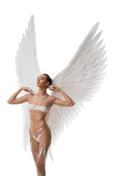 Nude brunette with beautiful wings and white bodyart full-length isolated shot