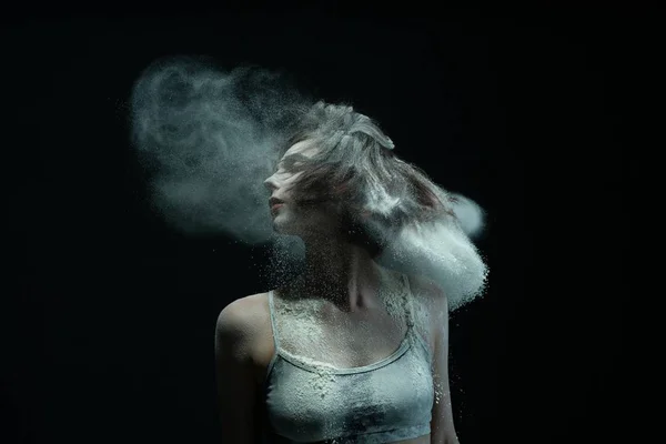 Woman portrait in white dust cloud in the dark — ストック写真