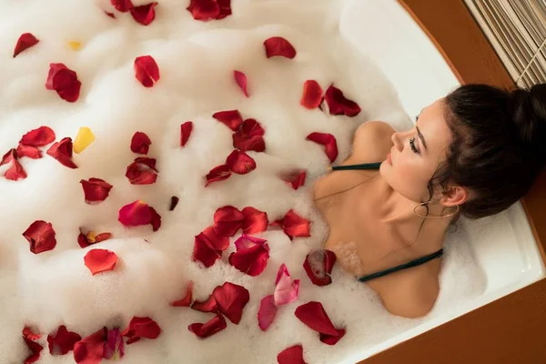 Beautiful brunette in foam bath — Stock Photo, Image