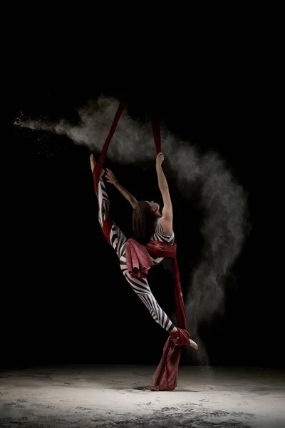 Beautiful dancer on cloth in dust cloud — Stock Photo, Image