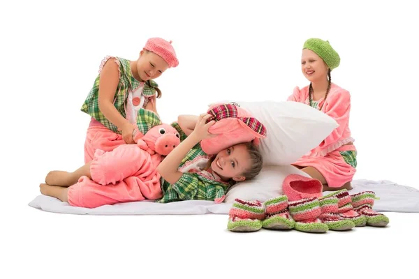 Girls in colorful pajamas and knitted shoes shot — Stock Photo, Image