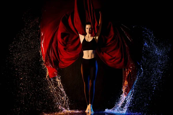 Fitness model shot in water drops with cloth — Stock Photo, Image