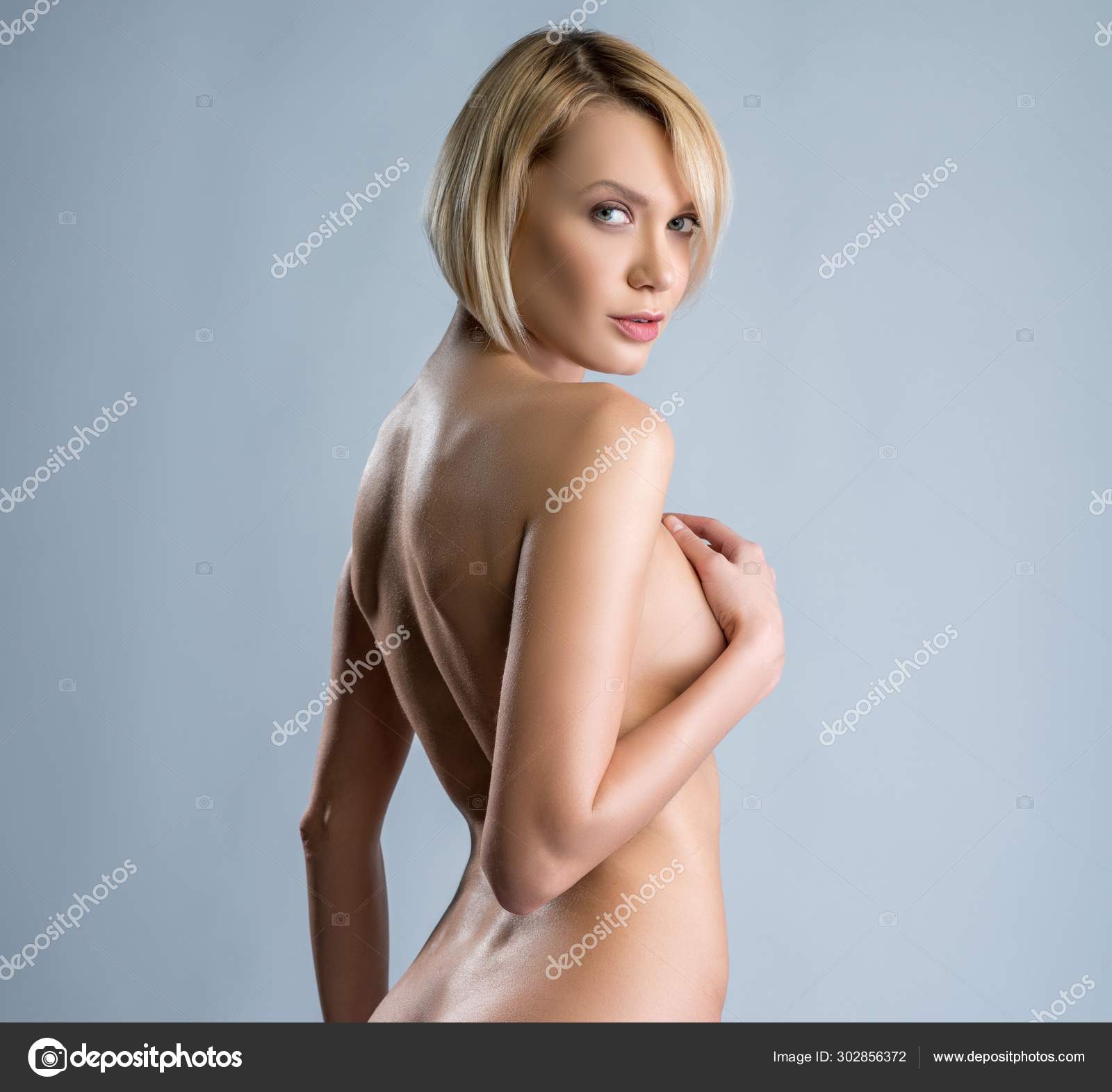 Naked Women Looking Behind Her