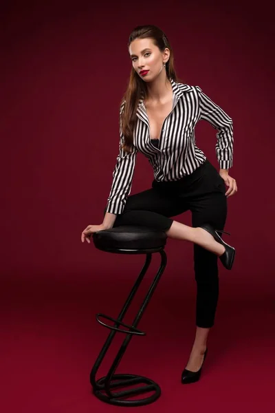 Brunette in sexy shirt portrait near bar stool — Stock Photo, Image