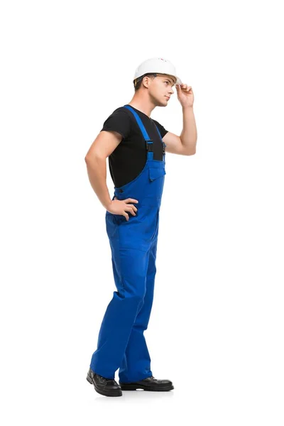 Homem de trabalho azul overolls e capacete isolado vista — Fotografia de Stock