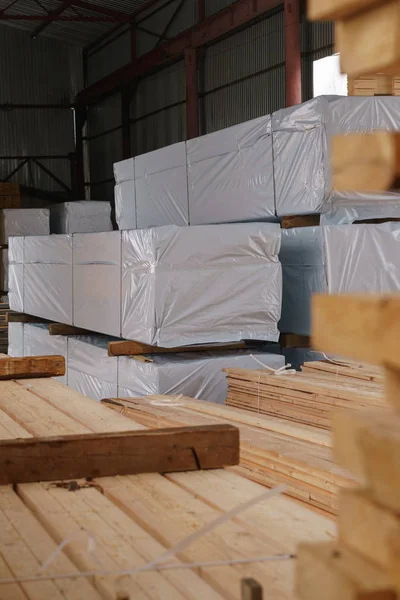 Warehouse at sawmill. Image of stacked boards