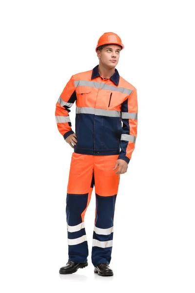 Man in werkende kleren en helm geïsoleerd schot — Stockfoto