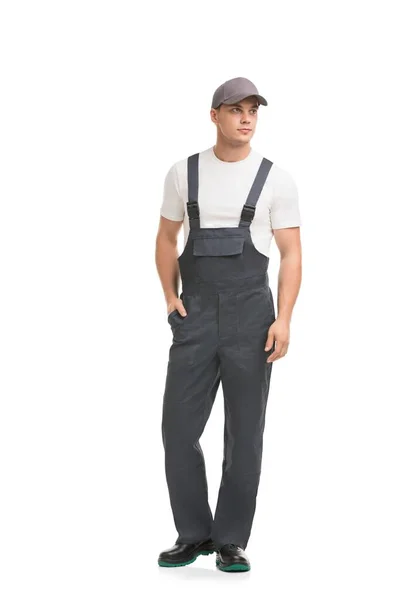 Knappe man in grijs werk overalls uitzicht — Stockfoto