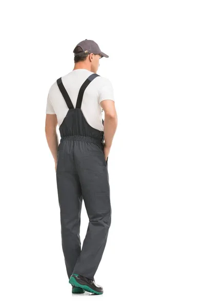 Knappe man in grijs werk overalls achteraanzicht — Stockfoto